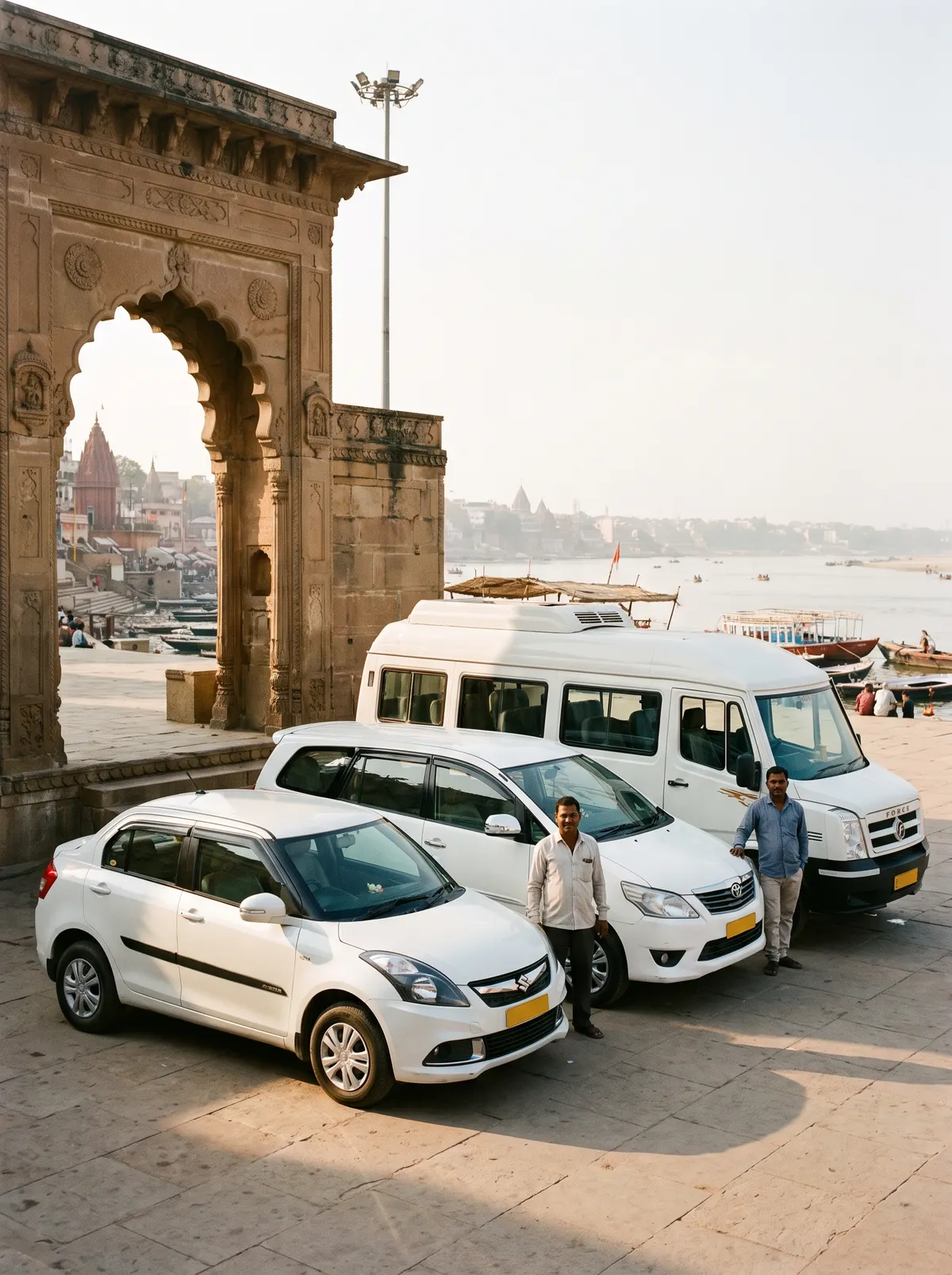 Sedan, SUV and tempo traveller parked in a row near the riverfront gateway