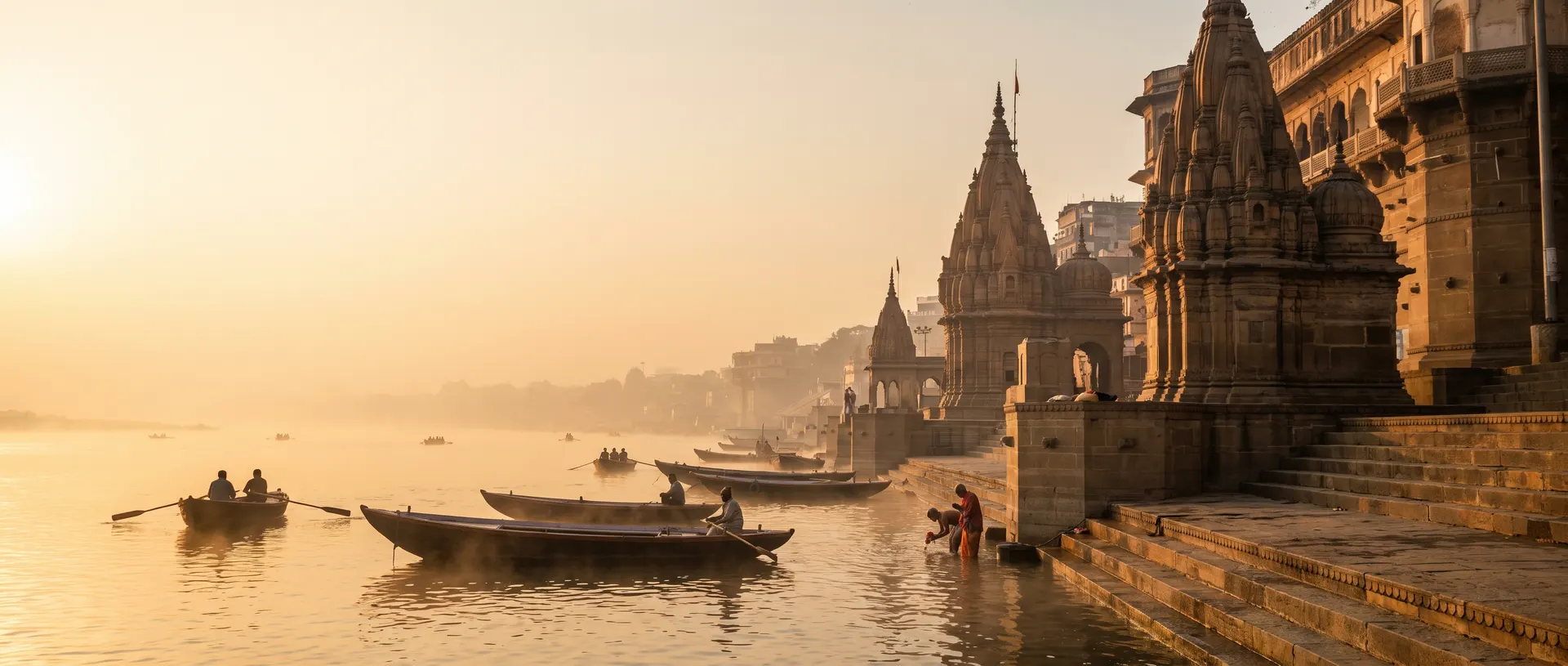Dawn over the Ganga at Varanasi: golden mist, boats and temple spires